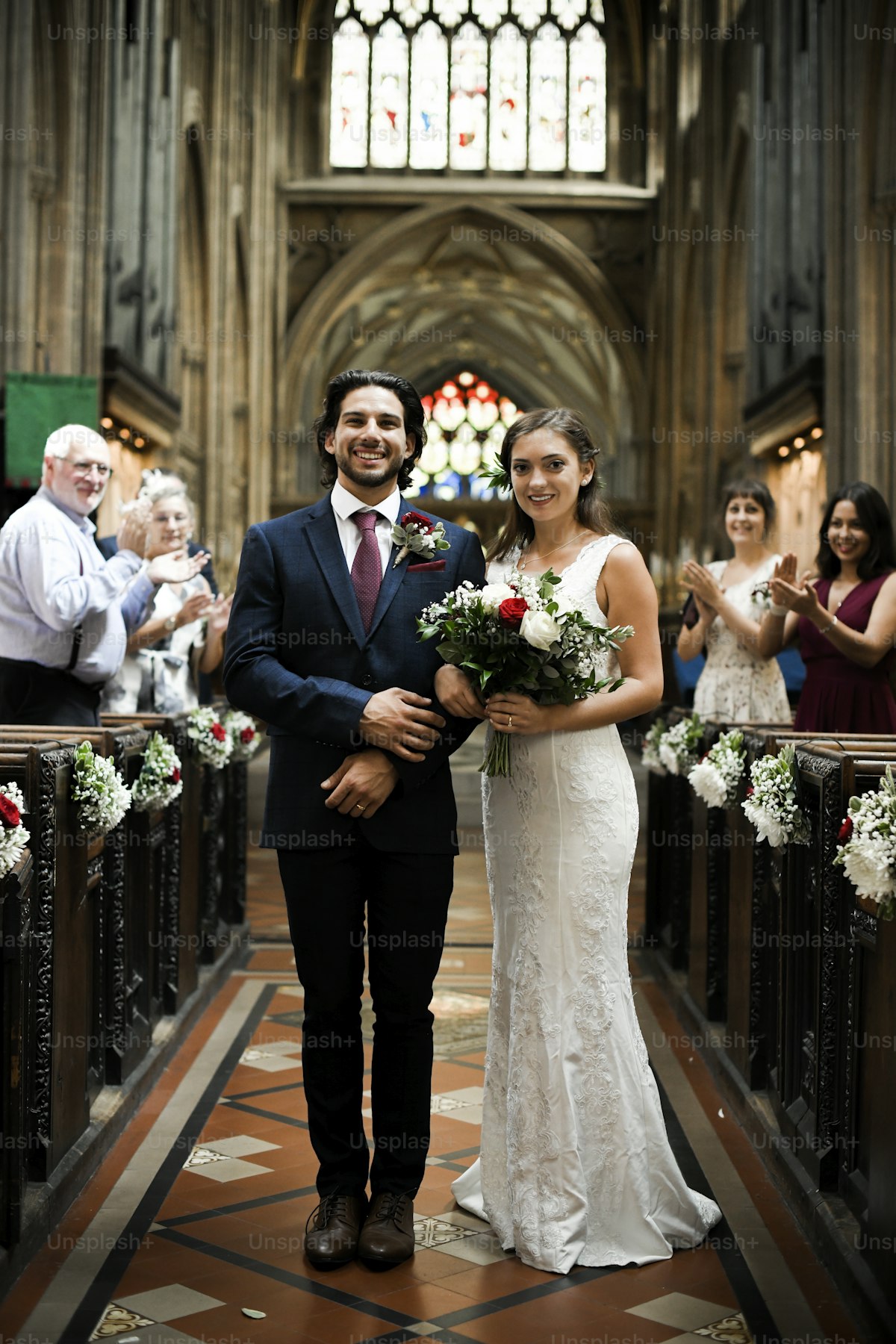 Newly wed couple walking down the aisle